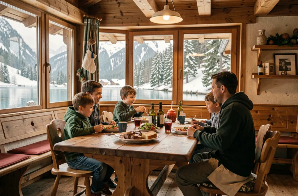 Famille attablée dans le chalet montagnard du Restaurant du Lac des Neiges à Isola, entourée d'un décor en bois typique des Alpes